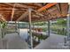 Covered boat dock with two red chairs and lake view at 3795 Deer Run, Denver, NC 28037