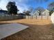 Large backyard with a concrete patio and fence at 511 E Sycamore St, Lincolnton, NC 28092