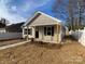 Newly constructed home with a welcoming front porch and well-manicured lawn at 511 E Sycamore St, Lincolnton, NC 28092