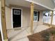 Stylish front door and covered porch with wooden posts at 511 E Sycamore St, Lincolnton, NC 28092