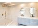 Elegant bathroom featuring double vanity, marble tile, and gold fixtures at 678 Wagner St, Troutman, NC 28166