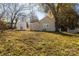 Backyard view of house with shed and tree coverage at 102 Oakland St, Clover, SC 29710