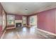 Spacious living room features hardwood floors and a wood-burning fireplace at 1209 Mount Ulla Hwy, Mooresville, NC 28115