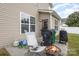 Small patio with fire pit and space for grilling at 13919 Highland Meadow Rd, Charlotte, NC 28273