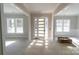 Bright entryway with glass front door and hardwood floors at 1875 Rock Hill Church Rd # 4, Matthews, NC 28104