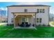 Home's exterior showcasing a covered patio and landscaped yard at 1875 Rock Hill Church Rd # 4, Matthews, NC 28104