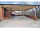 Covered carport with brick and concrete flooring at 216 Delview Dr, Cherryville, NC 28021