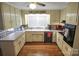 Galley kitchen with light wood cabinets and appliances at 216 Delview Dr, Cherryville, NC 28021