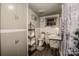 Clean bathroom with toilet, sink, and storage at 241 4Th N Ave, Taylorsville, NC 28681