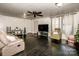 Living room with hardwood floors, ceiling fan, and comfortable seating at 241 4Th N Ave, Taylorsville, NC 28681