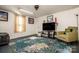 Living room with hardwood floors, ceiling fan, and area rug at 241 4Th N Ave, Taylorsville, NC 28681