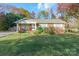 Brick ranch home with a well-maintained lawn and mature trees at 4062 Palmetto Dr, Rock Hill, SC 29732