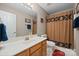 Simple bathroom with shower/tub and wood vanity at 4395 Pine Harbor Dr, Denver, NC 28037