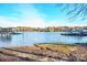 Calm lakefront view with multiple docks and houses in the background at 4395 Pine Harbor Dr, Denver, NC 28037