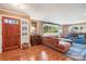 Spacious living room with hardwood floors and large window at 5001 Currituck Dr, Charlotte, NC 28210