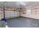 Garage with overhead door and built in shelving at 6327 Cherry Blossom Cir, Indian Land, SC 29707