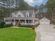 Two-story home with detached two-car garage and large yard at 6998 Ridgeway Rd, Stanley, NC 28164