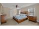 Bright bedroom with ceiling fan and wood platform bed at 10945 Caroline Acres Rd, Indian Land, SC 29707