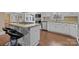 White kitchen cabinets, granite countertops and island at 10945 Caroline Acres Rd, Indian Land, SC 29707