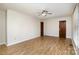 Bedroom with hardwood floors, ceiling fan, and ample natural light at 161 Eastcliff Se Dr, Concord, NC 28025