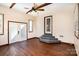 Sunroom with hardwood floors, French doors, and a unique staircase at 161 Eastcliff Se Dr, Concord, NC 28025