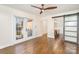 Main bedroom with hardwood floors, access to a deck, and barn door to the bathroom at 2013 Wood Dale Ter, Charlotte, NC 28203