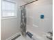 Bathroom features a shower/tub combo and gray patterned shower curtain at 267 Elm Nw Ave, Concord, NC 28025