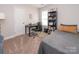 Bright bedroom with a built-in bookshelf and a desk at 267 Elm Nw Ave, Concord, NC 28025