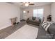 Living room features gray sofa, white rug, and entryway at 267 Elm Nw Ave, Concord, NC 28025