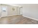 Bright bedroom with wood-look floors and door at 287 Young Sw Ave, Concord, NC 28025