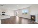 Living room featuring a corner fireplace and hardwood floors at 433 Court House Ave, York, SC 29745