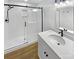 Updated bathroom with walk-in shower and modern vanity at 5003 Sharon Rd # S, Charlotte, NC 28210