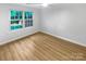 Bright bedroom with hardwood floors and large windows at 5003 Sharon Rd # S, Charlotte, NC 28210