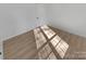Well-lit bedroom with hardwood floors and door at 5003 Sharon Rd # S, Charlotte, NC 28210