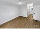 Bright bedroom with light wood flooring and access to a bathroom at 5003 Sharon Rd # S, Charlotte, NC 28210