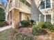 Ground level condo entrance with private patio and landscaping at 5003 Sharon Rd # S, Charlotte, NC 28210