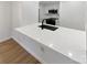 Modern kitchen island with white quartz countertop at 5003 Sharon Rd # S, Charlotte, NC 28210
