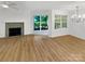 Bright living room with fireplace and sliding door to patio at 5003 Sharon Rd # S, Charlotte, NC 28210