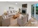 Virtually staged living room featuring fireplace and hardwood floors at 5003 Sharon Rd # S, Charlotte, NC 28210
