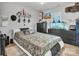 A bedroom featuring a white bed, a fish tank, and decorative items at 5110 Darby Dr, Monroe, NC 28110