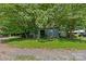 Metal storage shed in a wooded area at 5621 Mount Olive Church Rd, Charlotte, NC 28278