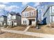 Two-story home on a tree lined street with other homes at 9130 Ramsford Ct, Charlotte, NC 28227