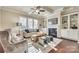 Living room with hardwood floors, a fireplace, and built-in shelving at 9528 Gladden Hill Ln, Pineville, NC 28134