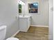 Bathroom with updated vanity and vinyl flooring at 104 Abingdon Cir, Huntersville, NC 28078