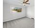 Bright bedroom with gray carpeting and a large window at 104 Abingdon Cir, Huntersville, NC 28078