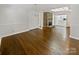 Dining room with hardwood floors and a stone fireplace at 104 Abingdon Cir, Huntersville, NC 28078