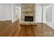 Stone fireplace in living room with hardwood floors at 104 Abingdon Cir, Huntersville, NC 28078