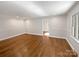 Spacious living area with hardwood floors and neutral wall colors at 104 Abingdon Cir, Huntersville, NC 28078