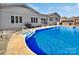 Inviting kidney-shaped pool with surrounding deck and hot tub at 104 Abingdon Cir, Huntersville, NC 28078