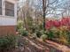 Landscaped backyard with a variety of trees and shrubs at 1511 Anthony Dr, Gastonia, NC 28052